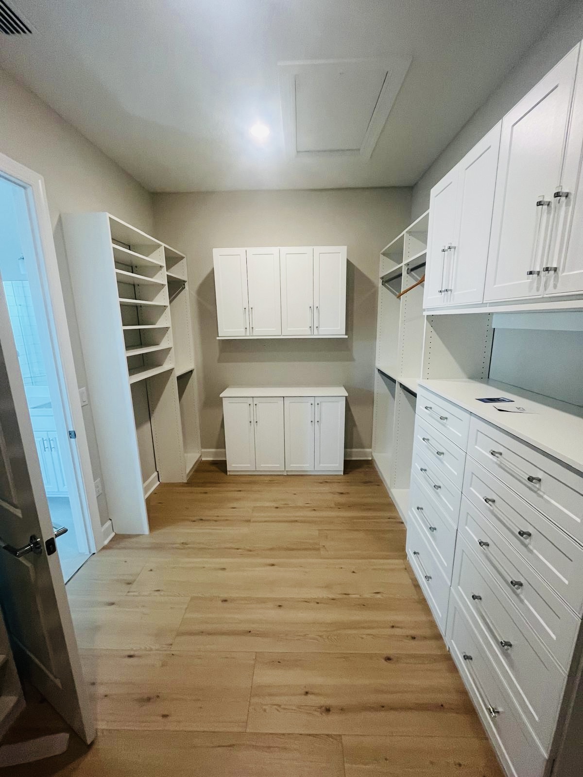 Custom closet storage solution with full cabinetry in Lakewood Ranch FL