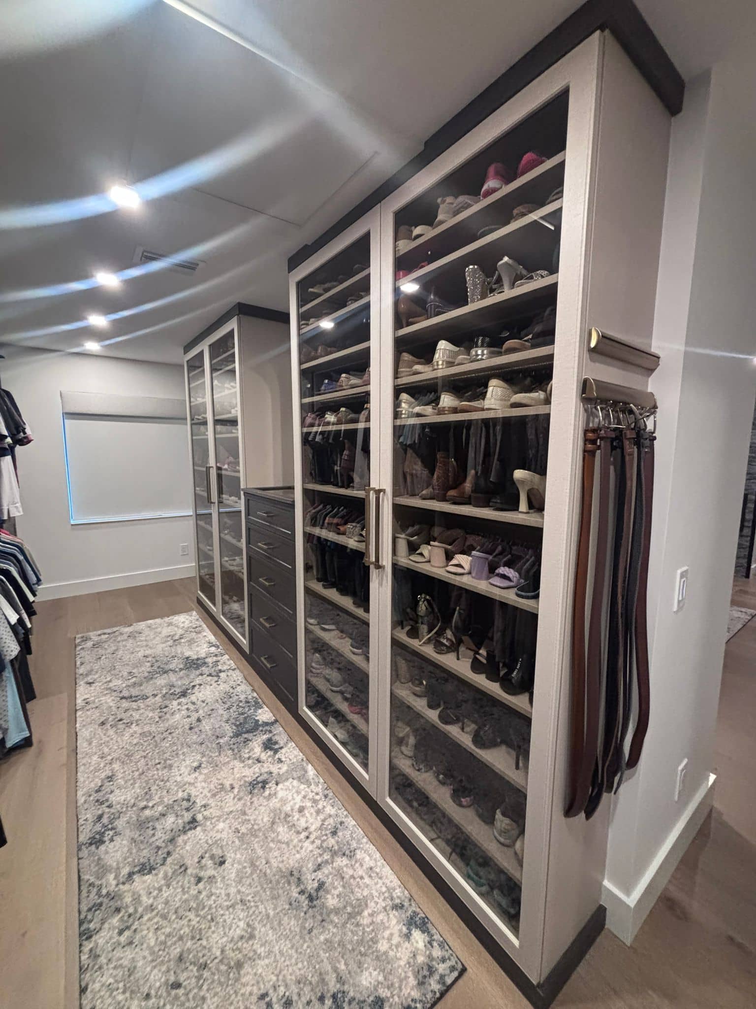 Custom premium wardrobe closet design with luxury finishes and hardware by Dream Closets LLC in Bradenton FL