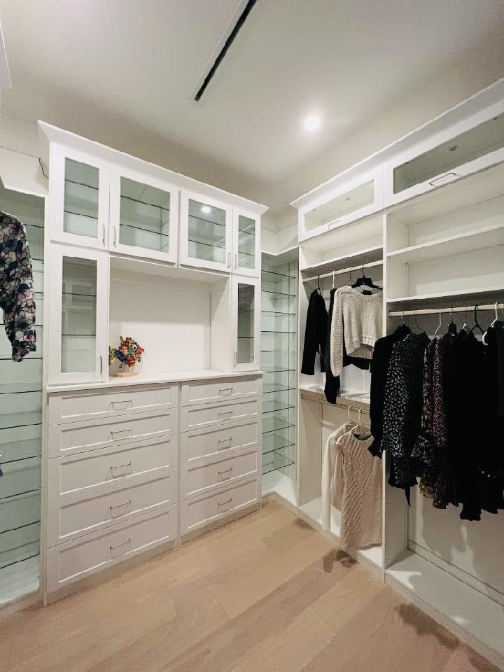 Completed custom walk-in closet installation with built-in cabinetry and organized storage zones in Sarasota FL